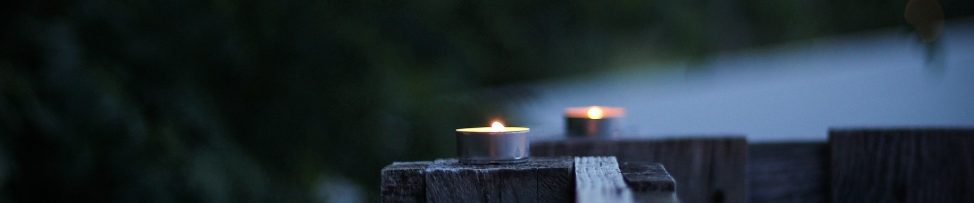image of candles on a railing